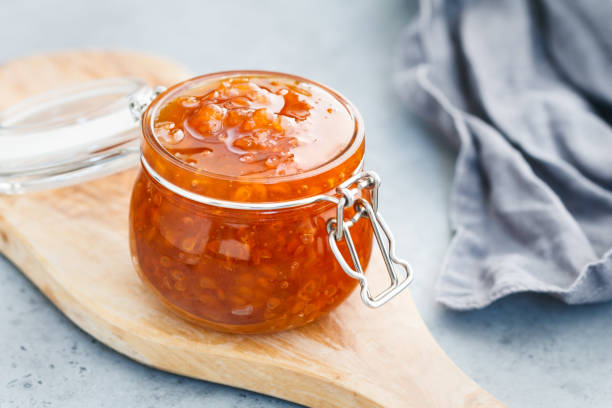 Glass jar with cloudberry jam. Nordic cuisine.