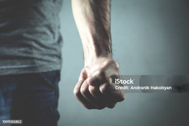 Caucasian Angry And Aggressive Man Threatening With Fist Stock Photo - Download Image Now
