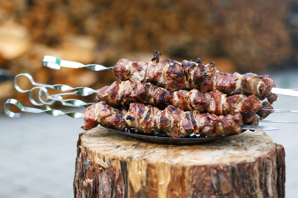 istock Freshly prepared pork barbecue on skewers. 1009359090