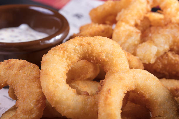 istock Deep-fried doughnuts with delicious white and red sauce. 1009362116