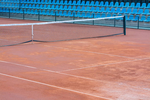 istock empty clay tennis court and net in time-out 1009369464