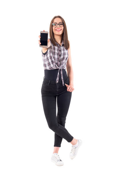 istock Excited young laughing stylish girl showing empty cellphone display at camera 1009390336