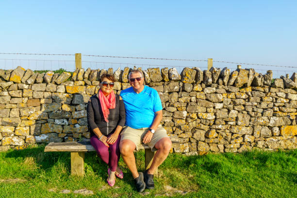 istock Senior couple sitting on bench 1009393538