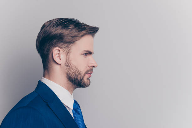 istock Profile, side view portrait with copy space, empty place for advertisement, product of stunning, attractive, brunet, brutal man isolated on grey background 1009421152