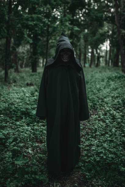 istock Death in black hoodie in forest 1009423924
