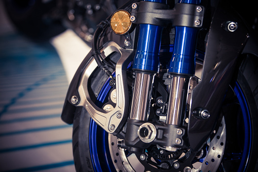 Color image of a new motorcycle front double shock absorbers.