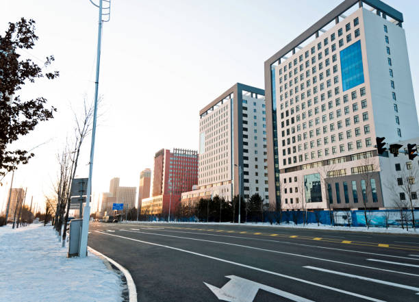 istock Empty street and modern building in winter 1009427570