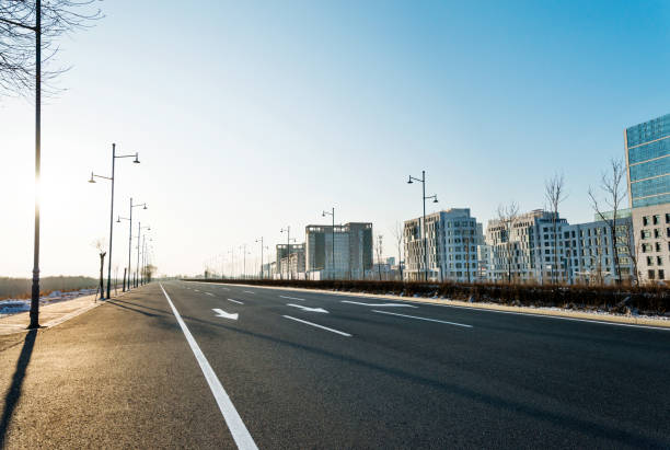 istock Empty street and modern building in winter 1009428036