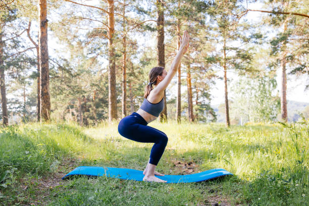 istock Young woman doing yoga 1009428088