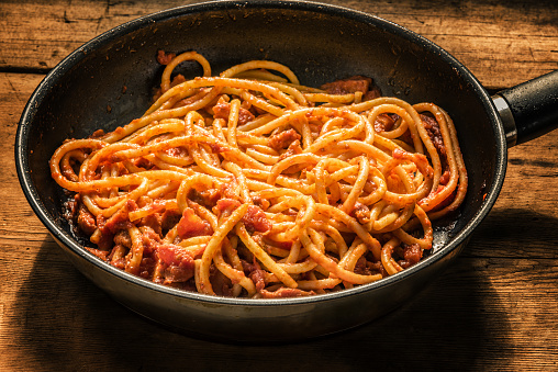 Classical Italian Pasta Amatriciana in a frying pan