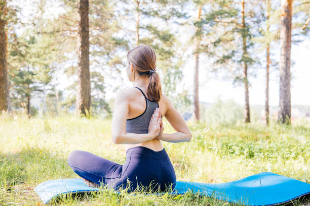 istock Young woman doing yoga 1009430812