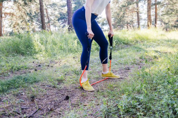 istock woman doing exercises in a park 1009435774
