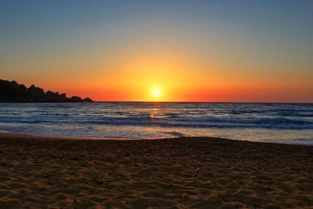 istock Beautiful sunset on a secluded Mediterranean sandy beach 1009436608