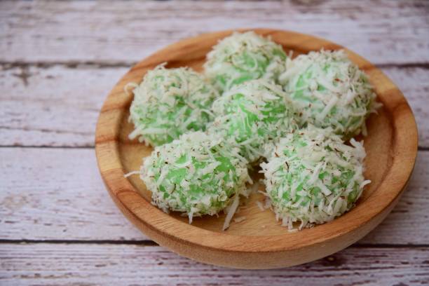 Klepon, pandan coconut rice balls Klepon, pandan coconut rice balls traditional malaysian food stock pictures, royalty-free photos & images