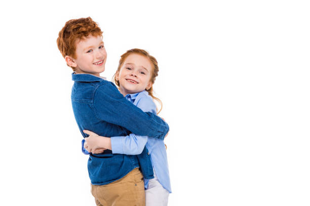 Group of multi ethnic children holding a white board