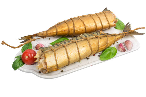 istock smoked rolled mackerel on white cutting board wis basil, tomatoes and spices isolated on white background 1009464754
