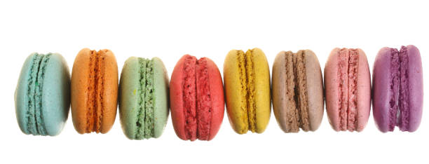 istock colored macaroons isolated on white background without a shadow closeup. Top view. Flat lay 1009467952