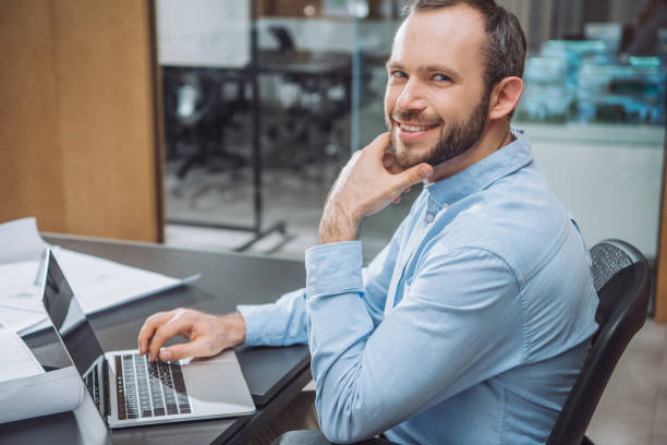 istock happy successful architect working with laptop at office 1009474514