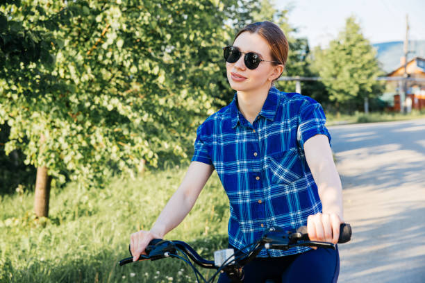 istock Young woman riding a bike 1009474712
