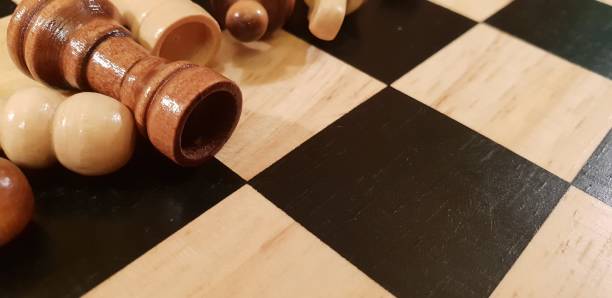 istock How to play wooden board game chess. Improvisation and Different angles of chess sets, pieces and chessboard. White and black figures and board of chess game. 1009499022