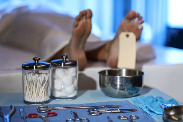 Corpse in morgue. Focus on toe tag. stock photo