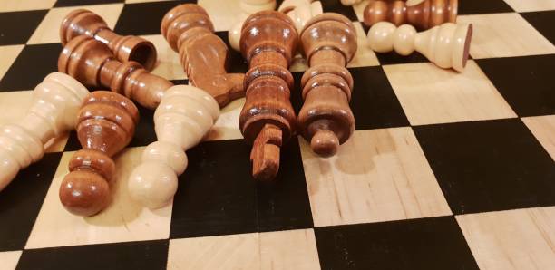 istock How to play wooden board game chess. Improvisation and Different angles of chess sets, pieces and chessboard. White and black figures and board of chess game. 1009504546