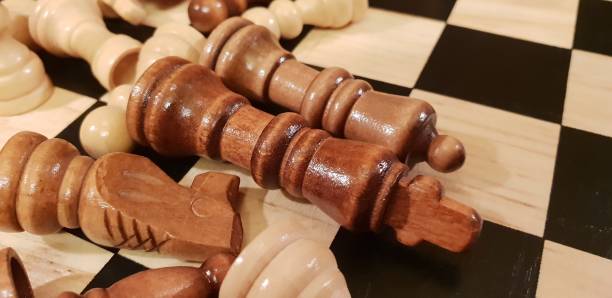 istock How to play wooden board game chess. Improvisation and Different angles of chess sets, pieces and chessboard. White and black figures and board of chess game. 1009504570