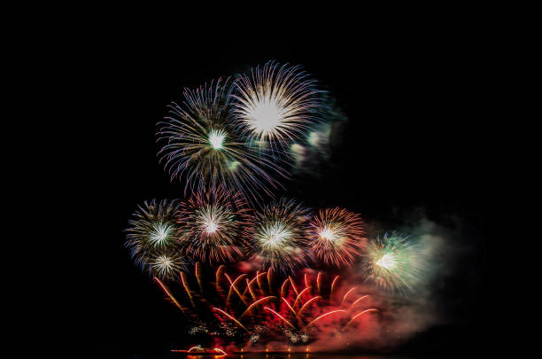 istock Amazing beautiful colorful fireworks light display on celebration up the sky night. 1009521596