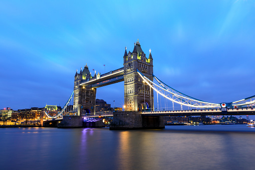 Tower Bridge at night in London , UK