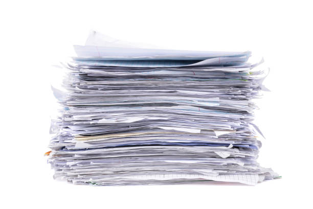 istock pile of messy school papers on white background 1009537200