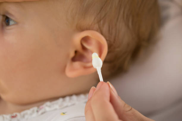 istock ear wax on cotton swab.baby ear 1009537782