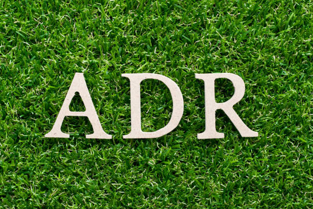 istock Wood alphabet in word ADR (Abbreviation of adverse drug reaction) on artificial green grass background 1009544588