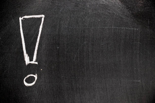 istock White color chalk hand drawing in exclamation mark with blank space shape on blackboard background 1009546692