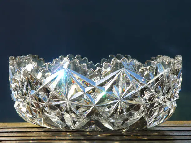 Elegant crystal bowl reflecting the light against a dark background