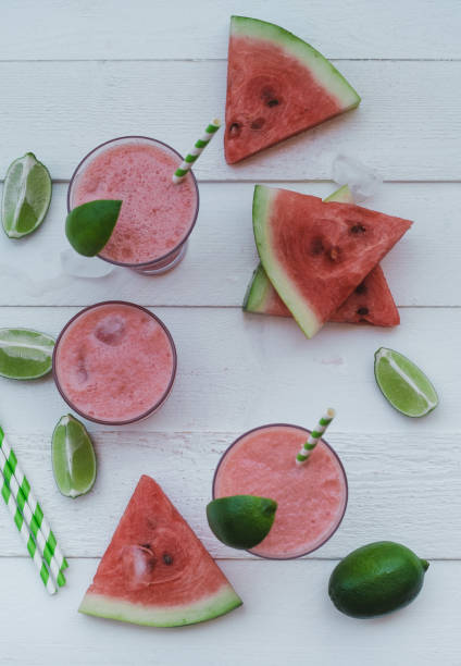istock Smoothies of fresh watermelon, lime with ice on a white table. Top view 1009554602