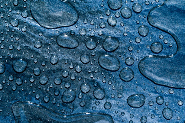 Natural rain water drops on a blue outdoor tile background Cape Town South Africa