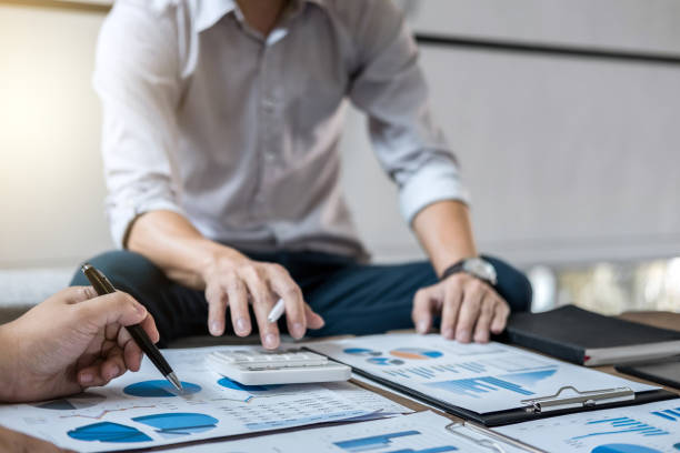 istock Young businessteam working with new startup project. discussing the charts and graphs showing the results at meeting. Business accounting and financial concept 1009573648