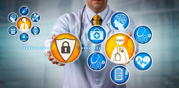 Unrecognizable cardiologist is providing telemedicine services to a remote male patient via a secure network. Healthcare technology concept for health data security, confidentiality and encryption.