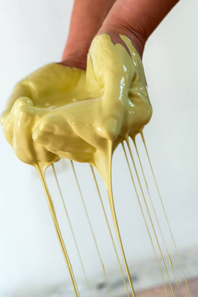 istock woman hands mixing paint, human home activity, color dripping down 1009580792