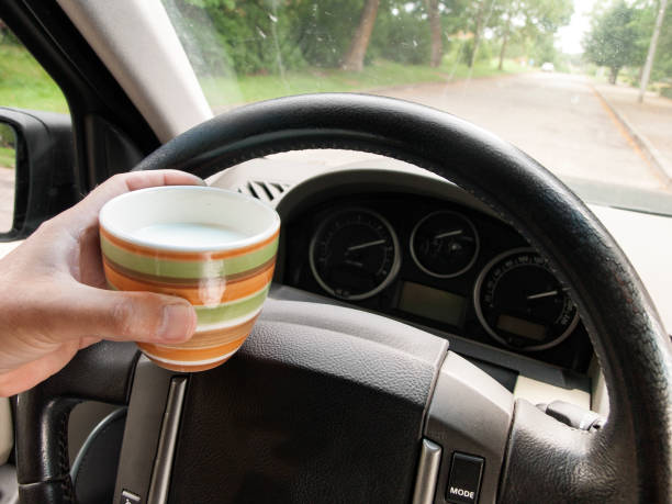 istock driving with a cup of milk 1009584270