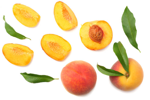 istock peach fruit with green leaf and slices isolated on white background. top view 1009616324