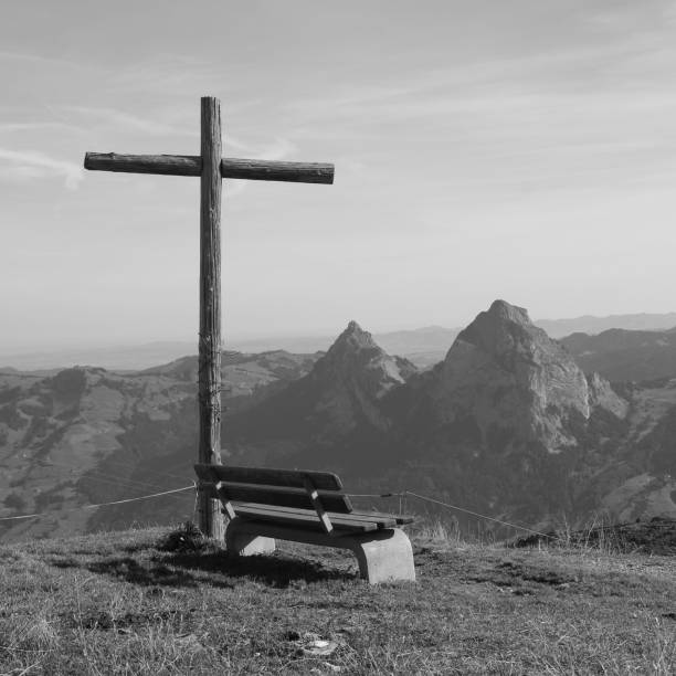 istock Summit cross and bench on Mount Fronalpstock. 1009616616