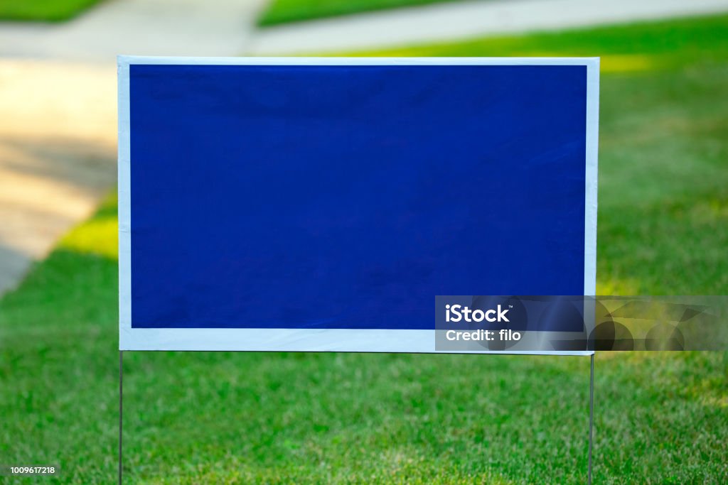 Blank Blue Yard Sign Blank blue political yard sign with space for copy. Sign Stock Photo