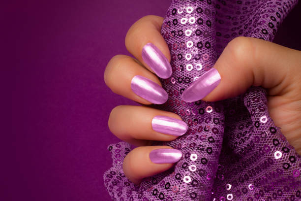 istock shiny purple nails manicure 1009619734
