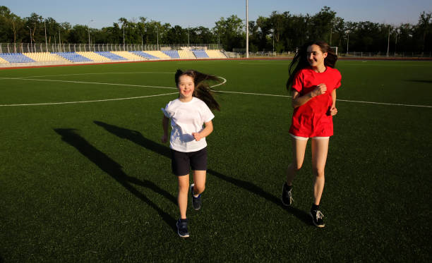 istock Little girl have fun on the stadium 1009623206