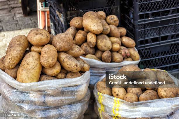 Fresh Organic Potatoes On The Market Closeup Texture Of A Potato Heap Of Potato Root Stock Photo - Download Image Now