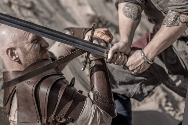 Two viking warriors fighting on a battlefield during a sparring session