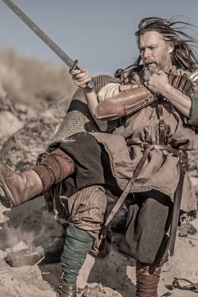 istock Two viking warriors fighting on a battlefield during a sparring session 1009626318