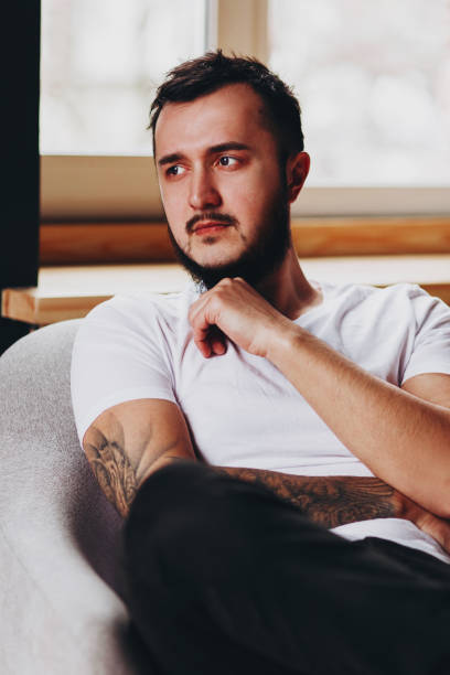 istock Brutal handsome man with tattooed body 1009629854
