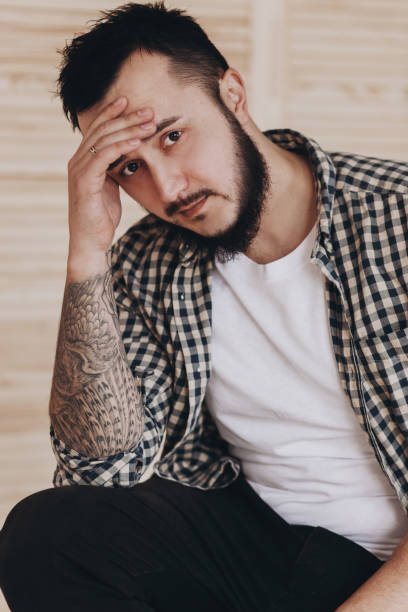 istock Brutal handsome man with tattooed body 1009629882